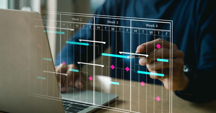 Project management concept , analyst working with computer in management system to make report with KPI and metrics connected to database.